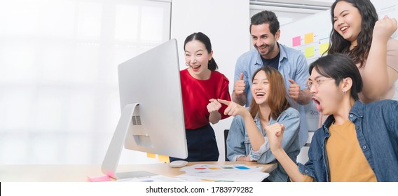 Inspire Your Teamwork To Keep On Achieving Group Of Asian Team Creative Business People Hand Raise Up Partnership Teamwork Concept Infornt Of Monitor Screen Modern Office Background