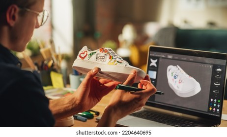 Inspired Blonde Man Creating Custom Made Model of Shoes and Looking at 3D Prototype Made in Editing Software on his Laptop. Arts and Unique DIY Objects For Personal Style Concept.