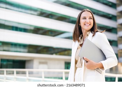 Inspired Businesswoman In Smart Casual Wear Carrying Laptop Walking On City Street, Smiling Attractive Female Office Employee Looking Aside Outdoors, Woman In Suit With Laptop Computer In Downtown