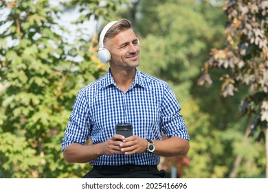 Inspired By Environment. Remote Work Advantages. Coffee Break. Reward Yourself And Encourage. Man Drinking Coffee Listening Favorite Music Artist. Lunch Time. Coffee Outdoors Nature Background