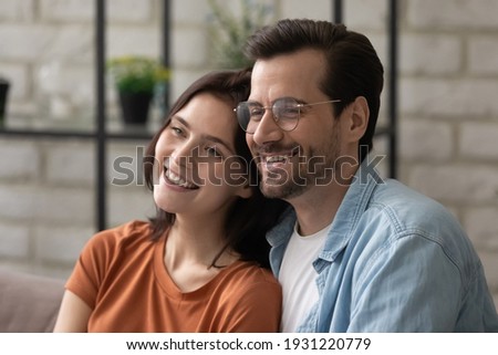 Image, Stock Photo Side view of loving couple looking at each other