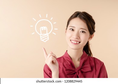 Inspired young asian woman. - Shutterstock ID 1208829445