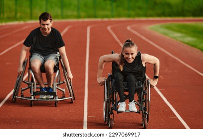 An inspiring couple with disability showcase their incredible determination and strength as they train together for the Paralympics pushing their wheelchairs in marathon track  - Powered by Shutterstock