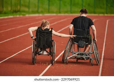 An inspiring couple with disability showcase their incredible determination and strength as they train together for the race pushing their wheelchairs in marathon track  - Powered by Shutterstock