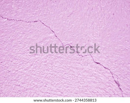 ​Fragility and instability abstract texture. A bold pink wall featuring a deep structural crack. This conceptual image serves as a powerful visual metaphor for vulnerability, crisis, and flaws.