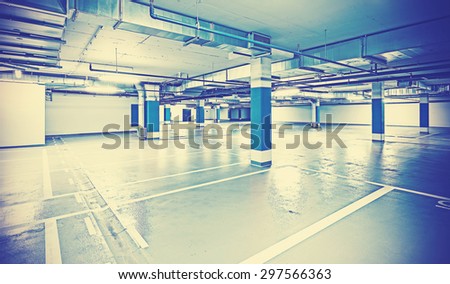 Similar – Empty multi-storey car park with yellow columns