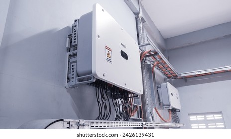 Instalation control of inverters solar panel on the wall. Technology of solar energy with shiny light.