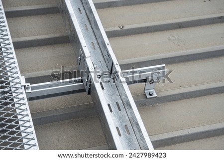 Install the cable tray on the solar system rails on the roof.