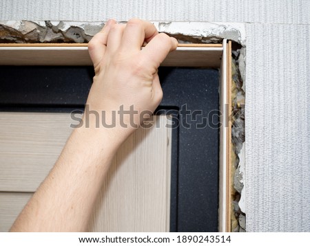 install doorframes and architraves on the front door on the foam