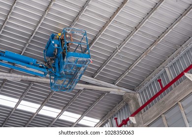 Install Fire Sprinkler System. In The Industrial Plant, Pipe Assembly, Red Fire Pipe, Fire Protection Contractors Using Scissor Lift High Work