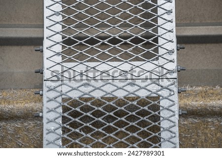Install steel walkway grating on the roof.