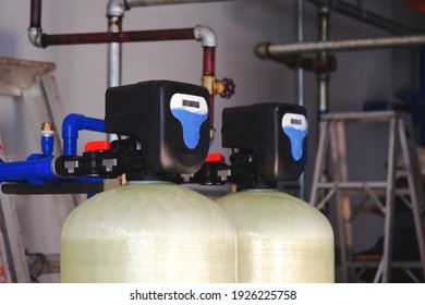 Install a water softener tank system inside the building.