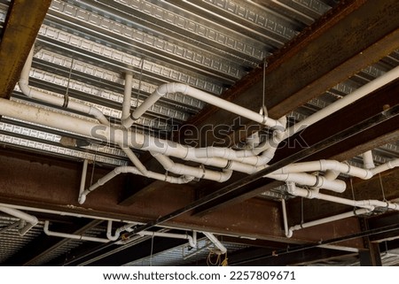 Installation an assembled in waste pipe lines system under ceiling of apartment building complex was completed
