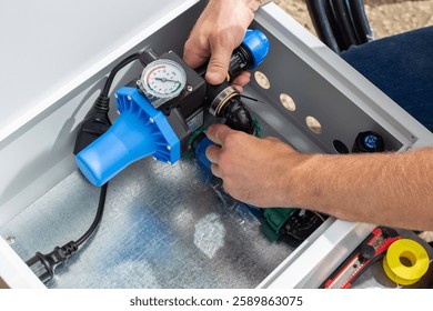 installation of the automatic control unit of the drip irrigation system, arrangement of the automatic control unit elements in a metal box.