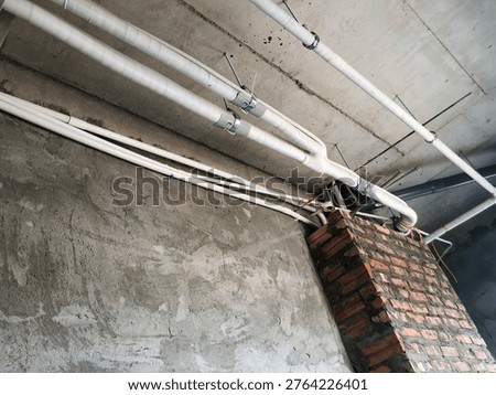 Installation of ceiling concealed HVAC, electrical and ventilation systems in building interior