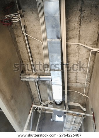 Installation of ceiling concealed HVAC, electrical and ventilation systems in building interior