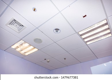 Installation Of Ceiling Tiles During Repair