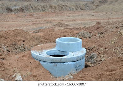 Installation Of Concrete Sewer Wells In The Ground At The Construction Site. The Use Of Reinforced Concrete Rings For Cesspools, Overflow Septic Tanks. Improvement Of Wells And Storm Sewage - Image