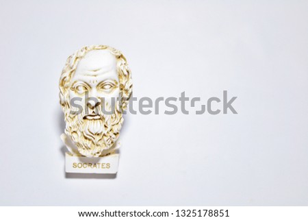 An installation consisting of Socrates statue on white background.