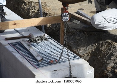 Installation Construction Of Street Gutter On The Road.