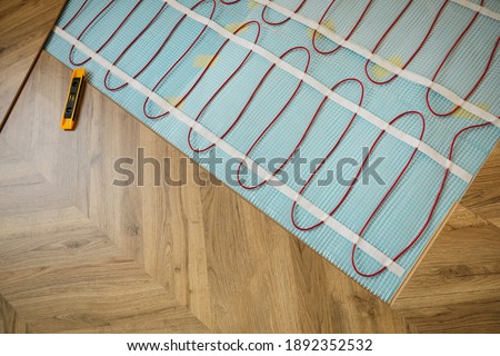 Installation of electric underfloor heating system indoors, above view