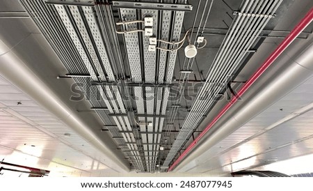 The installation of electrical conduits, cable trays, and fire pipes at the train station in Thailand.