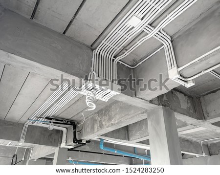 Installation of electrical wiring on the ceiling.Electrical cable system installation.