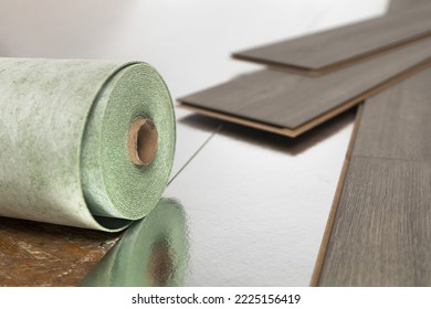 Installation of floating floor, underlay with sheets of laminate. Home improvement concept. - Shutterstock ID 2225156419