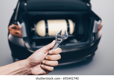 The Installation Of A Gas Cylinder For NGV In The Trunk Of A Car