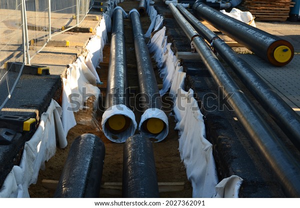 installation of hot water\
pipes for heating apartments. Insulated pipes are laid in the road\
for sand backfill. hot steam from the thermal power plant is\
conducted\
underground