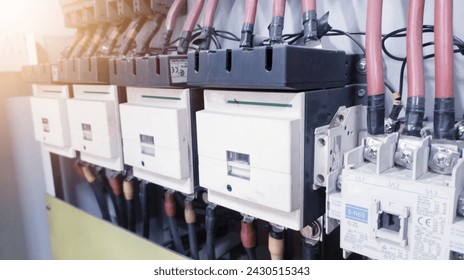 Installation the main magnetic conntactors on the Electrical  panel power plant in industry. - Powered by Shutterstock