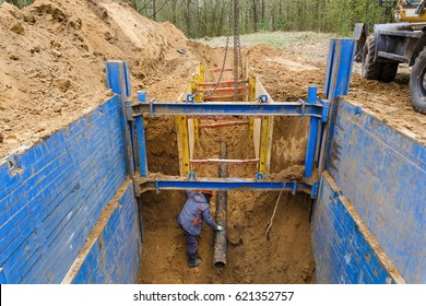 Installation Of Metal Supports To Protect The Walls Of The Trench. The Lining Protects The Walls From Collapsing And Save The Workers.