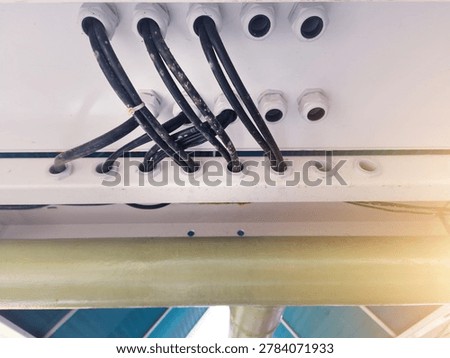 Installation of power input output panel cables through cable glands