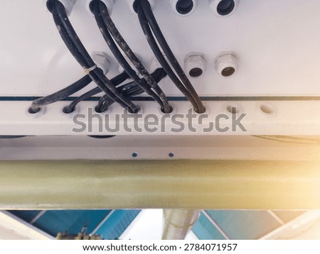 Installation of power input output panel cables through cable glands