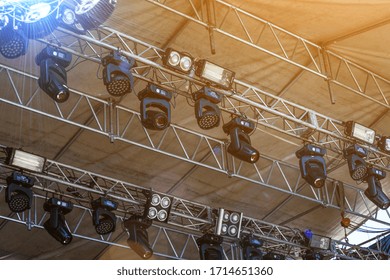 Installation Of Professional Sound, Light, Video And Stage Equipment For A Concert.Floodlights,several Powerful Stage Light,used To Illuminate Also Sports Field,stage,exterior Of Building.