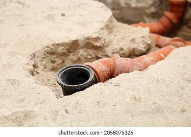 Installation Of PVC Sewer Pipes And Water Drain In A Bathroom. Close Up Detail Of Home Renovation And Repair.