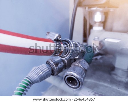 Installation quick couplers in air compressor pneumatic system.