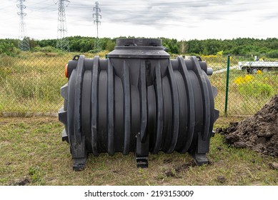 Installation Of A Single-chamber Home Sewage Treatment Plant, The Tank Is On The Lawn.