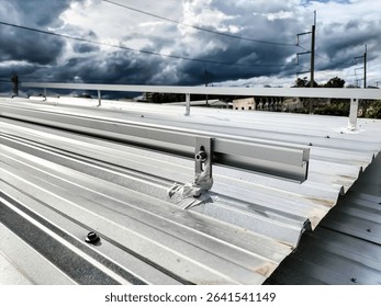 Installation of solar panel support rails on the roof.