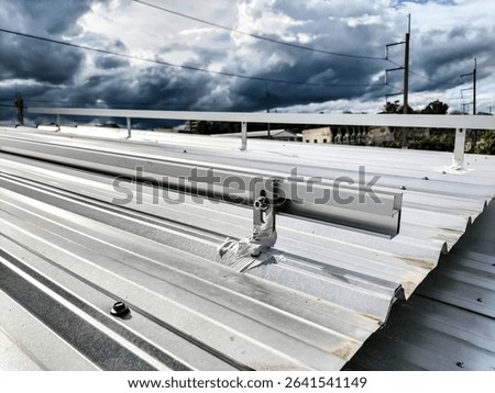 Installation of solar panel support rails on the roof.