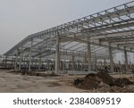 installation of steel roof trusses on new factory construction, steel frames on factory warehouses