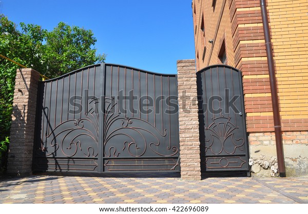 Installation of Stone and Metal Fence with Door and\
Gate for Car.