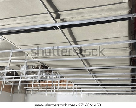 Installation of Suspended Ceiling Framework and HVAC Ducting System in Construction Site