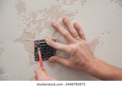 Installation, installation of a switch and socket in a socket box in the wall