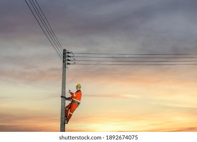 Installation Of Switching And Connecting Overhead Electrical Lines On A Pole. An Electrician Is Working On A Pole.Linemen.