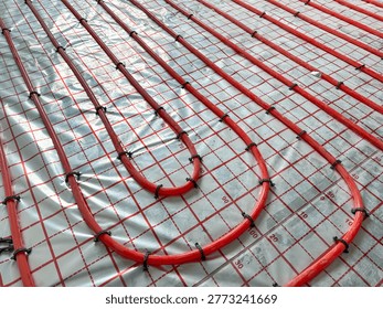Installation of underfloor heating system in building, above view