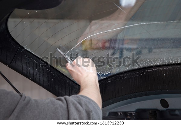 Installation of window film on car Windows.\
Protection from UV\
light.