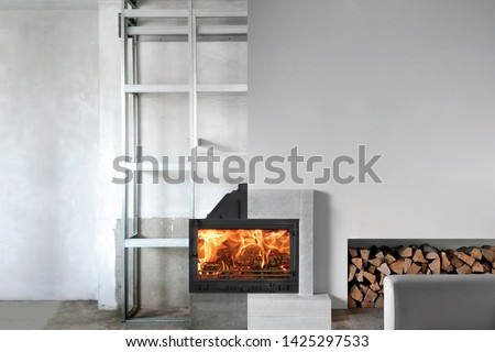 Installation of wood fireplace insert in livingroom.