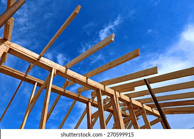 Installation Of Wooden Beams At Construction The Roof Truss System Of The Frame House