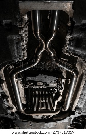 Installed custom exhaust system in performance car after TIG welding and automotive tuning.